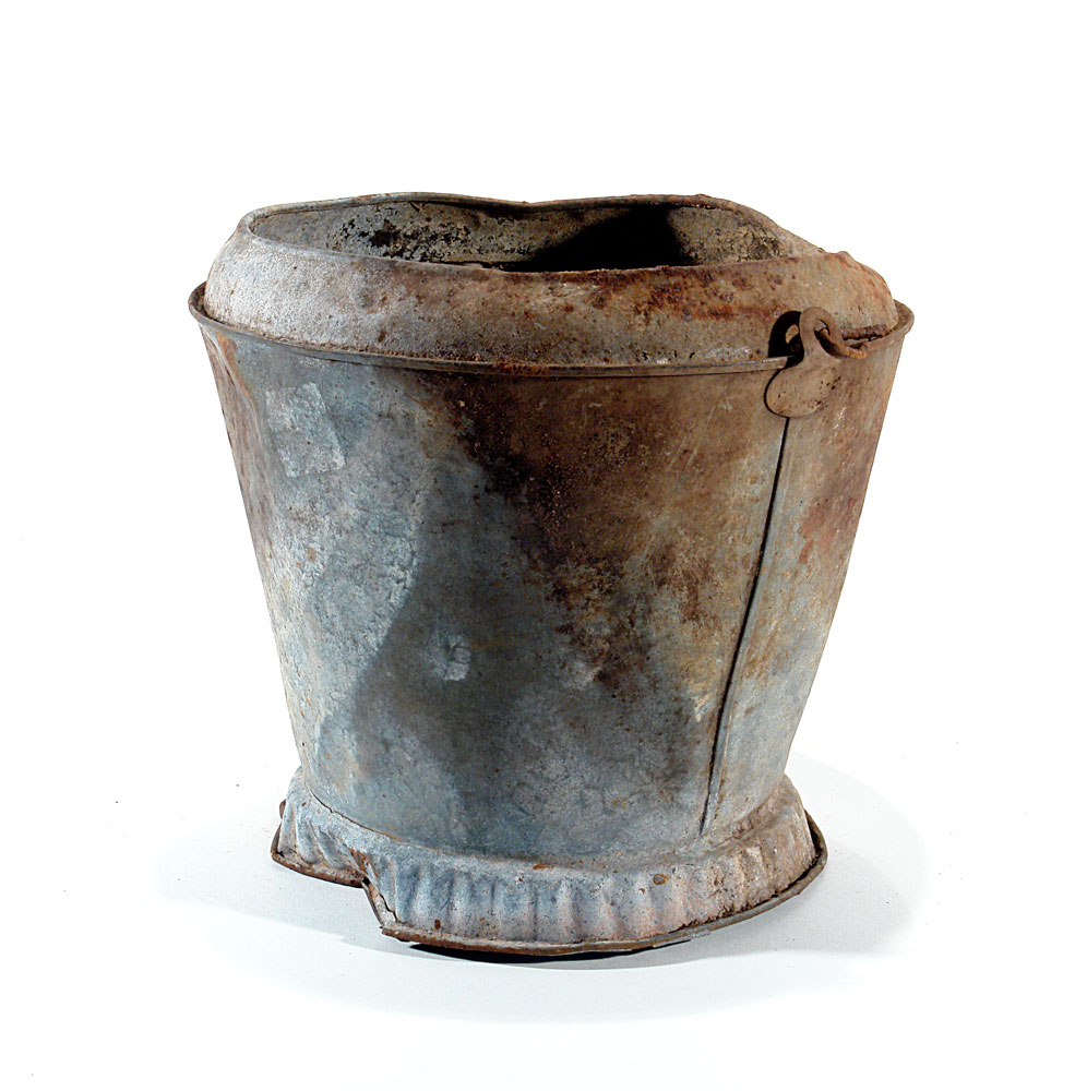 a metal bucket rusted, slightly damaged