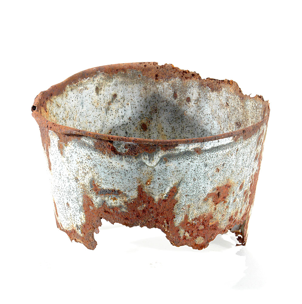 a metal bucket rusted, slightly damaged