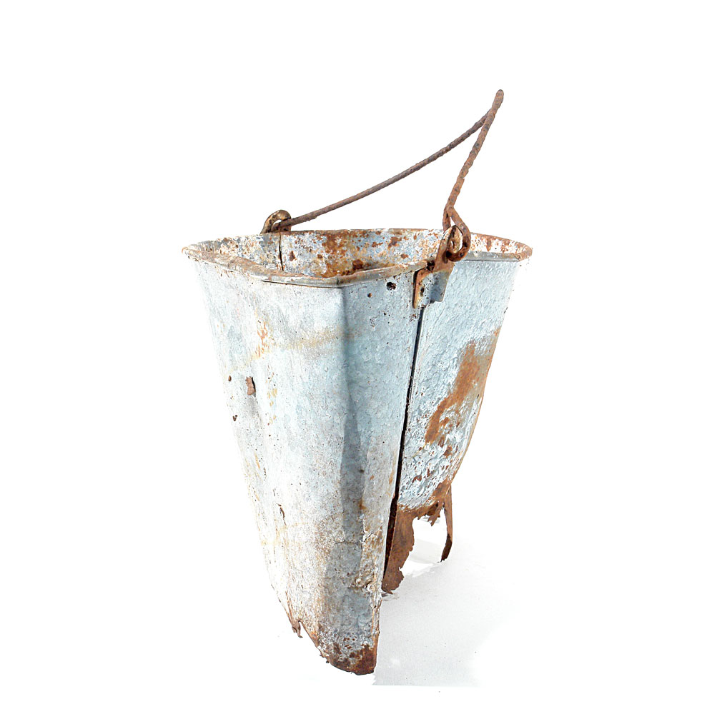 a metal bucket rusted, slightly damaged