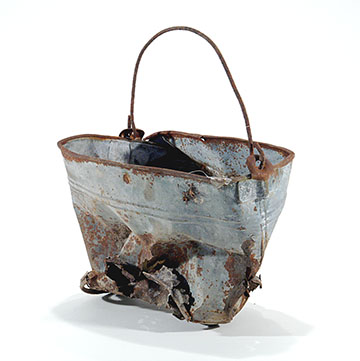 a rusted metal bucket