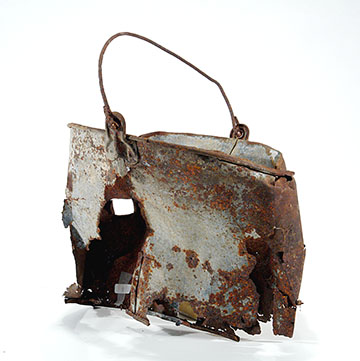 a rusted metal bucket